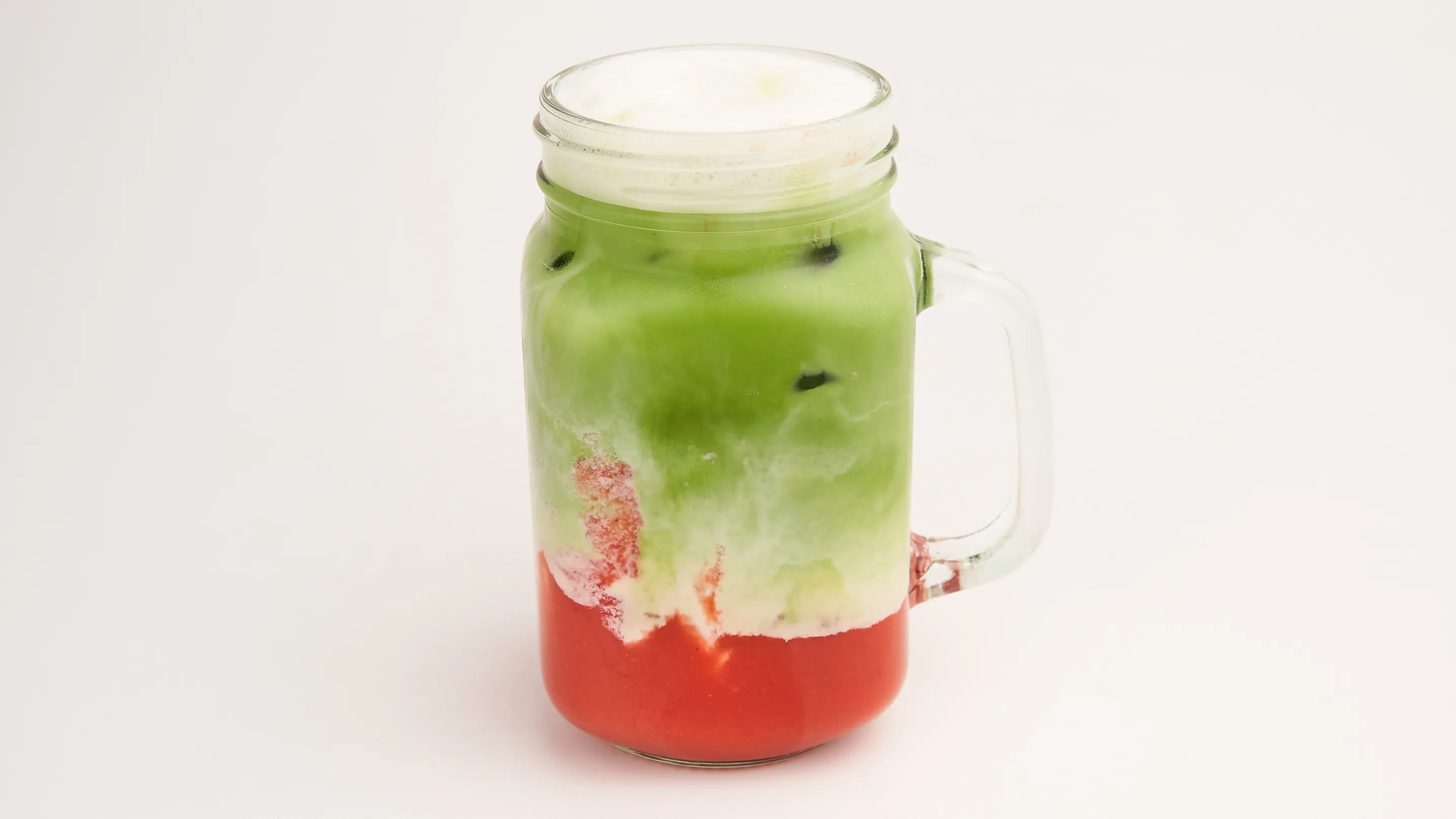 Strawberry matcha layered over ice